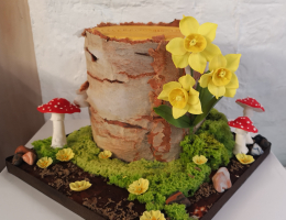 Springtime woodland tree stump cake
